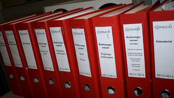 Colored document folders stacked together with their tabs facing outward